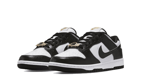 nike dunk low world champs black white front view