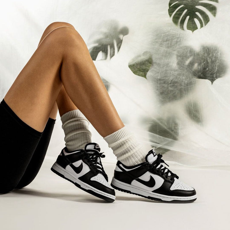 Nike Dunk Low Black and White on feet indoors